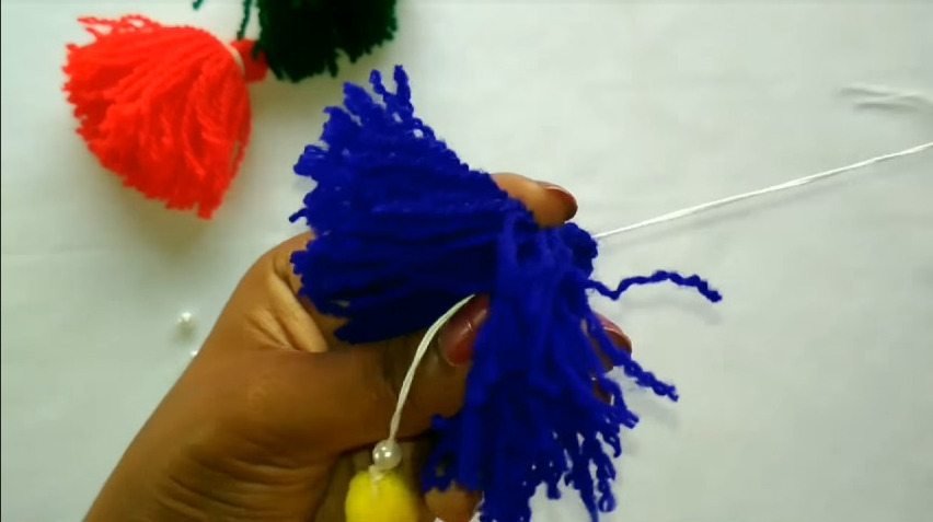 How to make woolen tassel bag charm very easily11