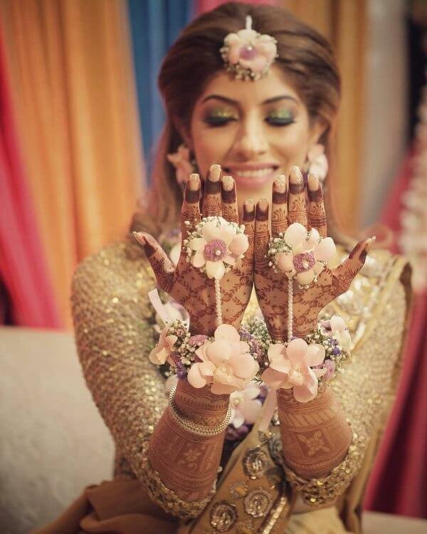 Bride in Baby pink colour flowers