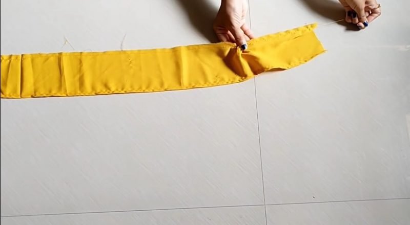 making the ruffles with yellow cloth