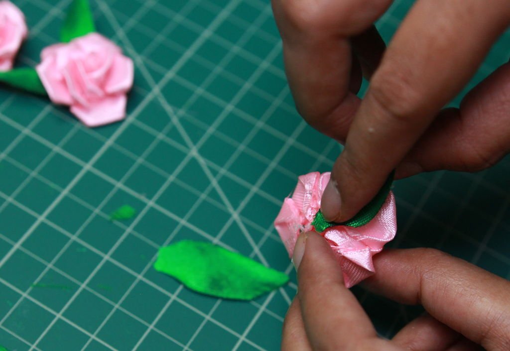 gluing leaves with the roses