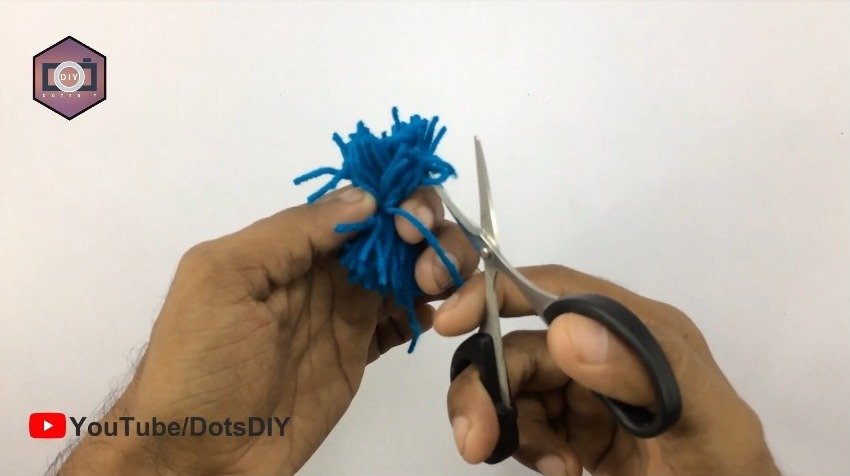 cutting it with scissors