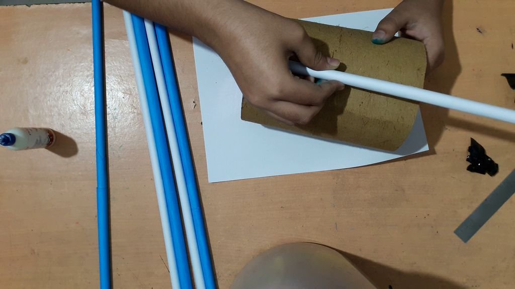 cover the cylindrical shape with paper sticks