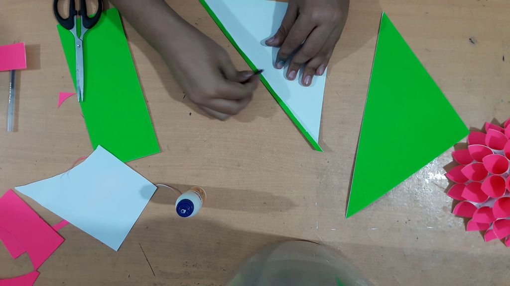 cutting green color paper