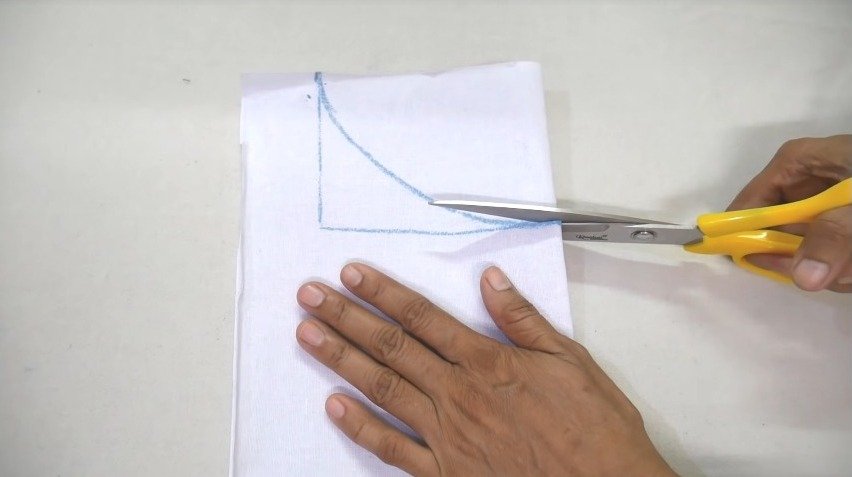 cutting through measurement lines with scissors