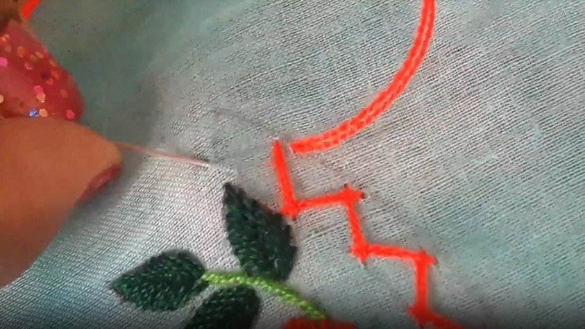 sewing a ziz zag stitch with orange thread