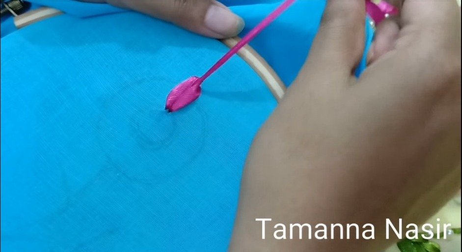 stitching the flower petal with ribbon