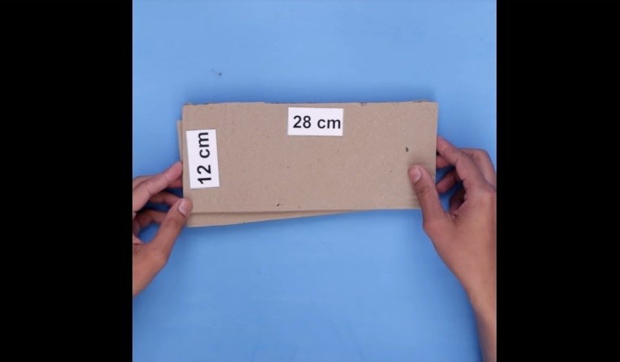 taking two cardboard sheets